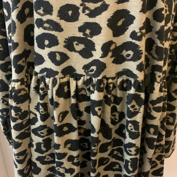 Woman’s long sleeve animal print babydoll top with rounded neckline. - Picture 4 of 8